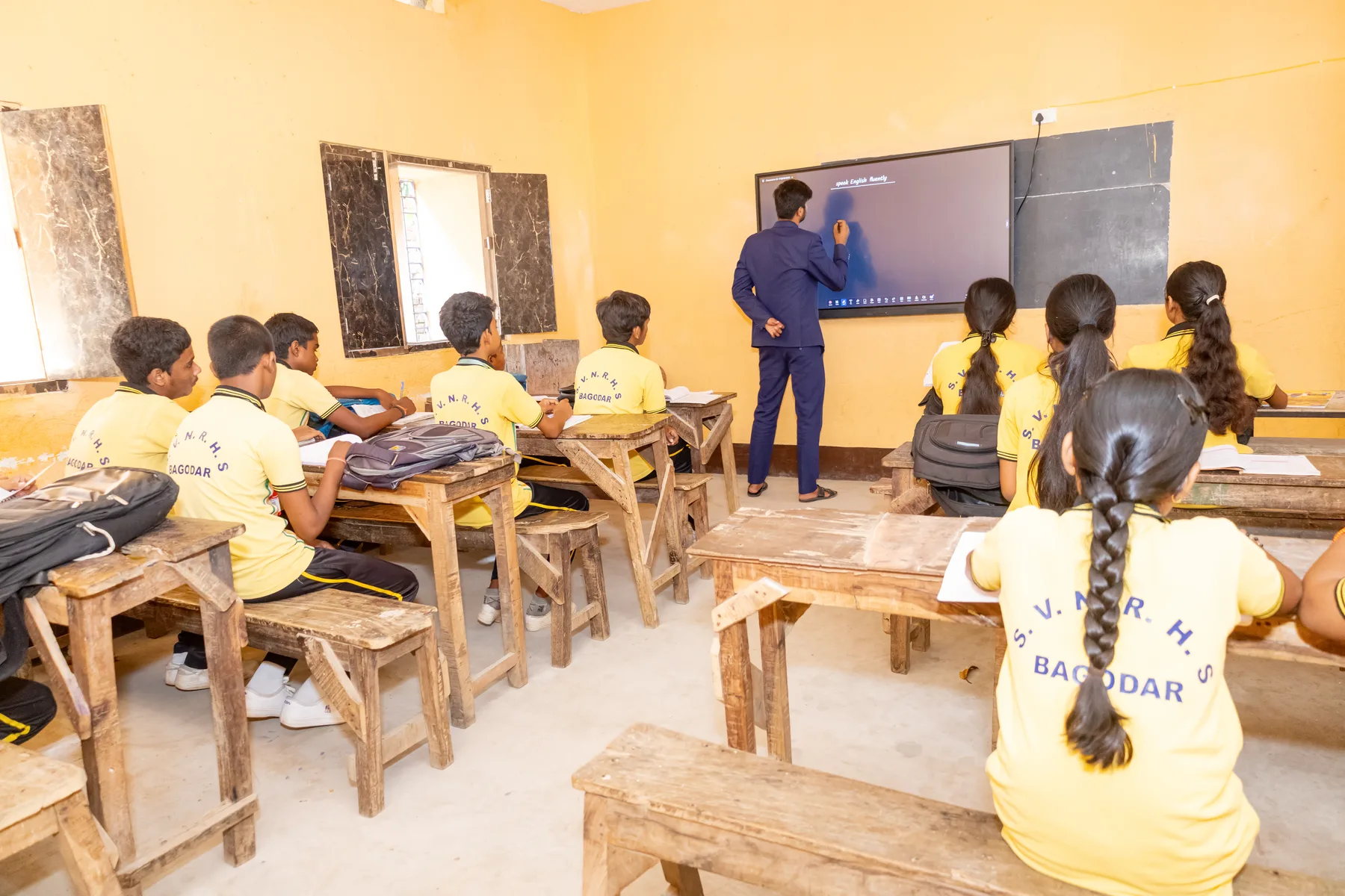 A teacher working at the blackboard