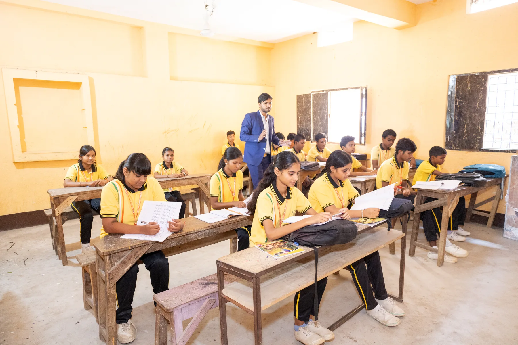 Students reading at their desks in class