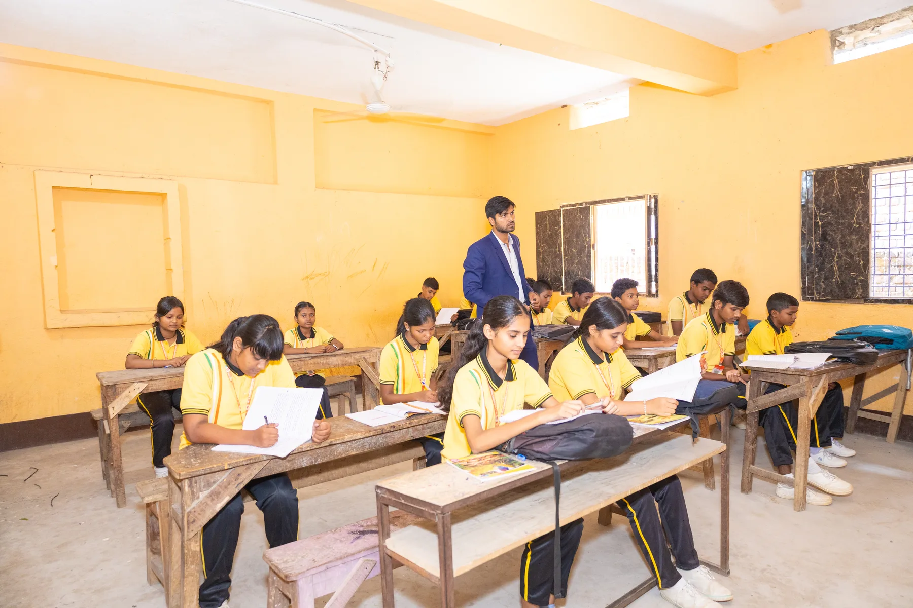 A full classroom with the teacher taking a lesson