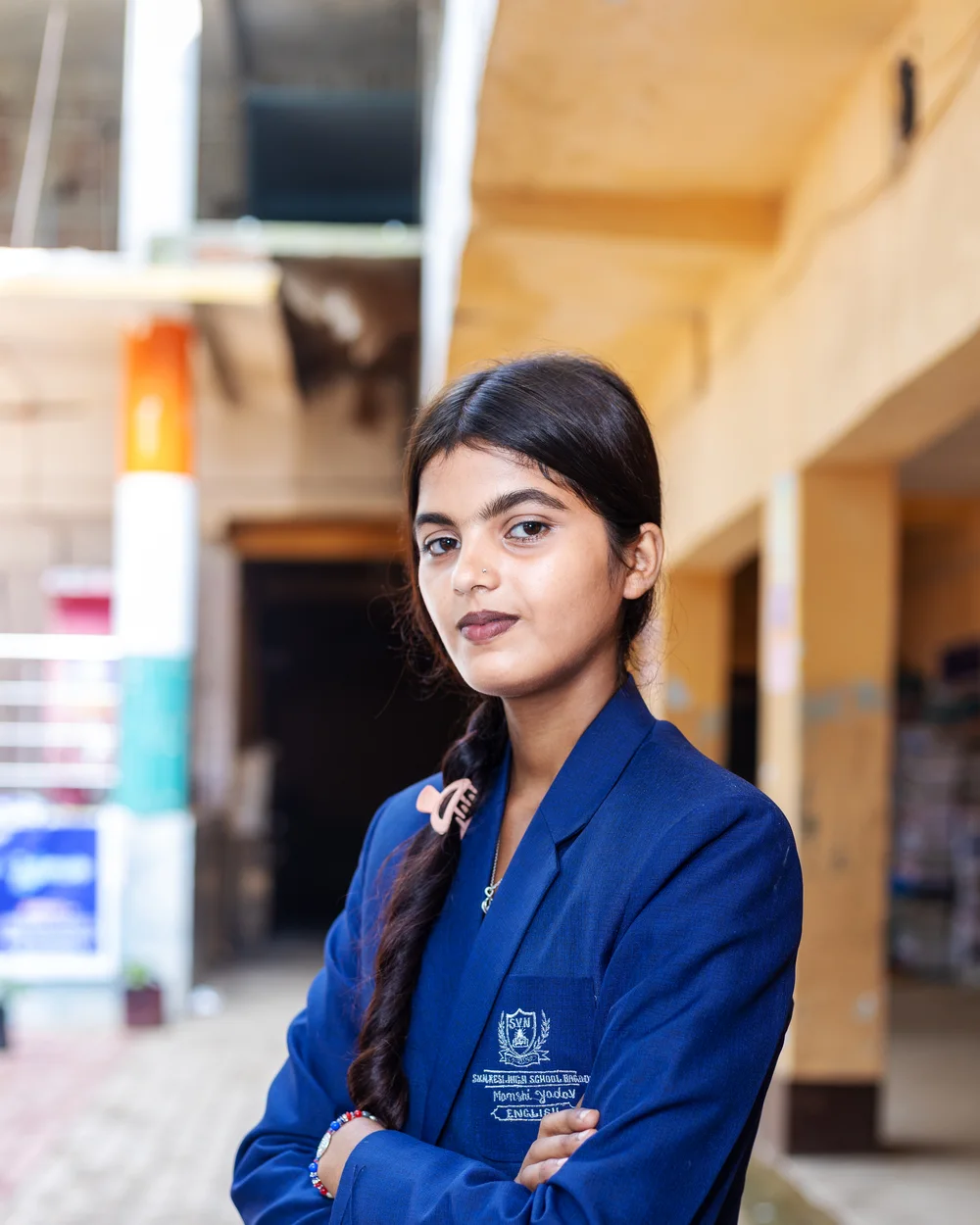 A member of the teaching staff photographed on the school verandah