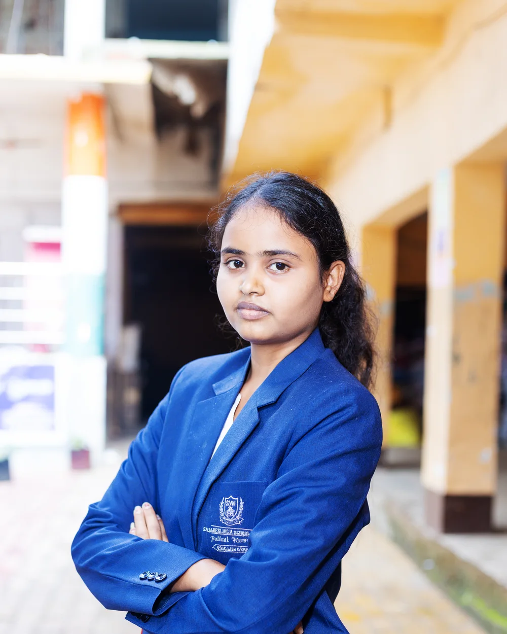 A member of the teaching staff photographed on the school verandah