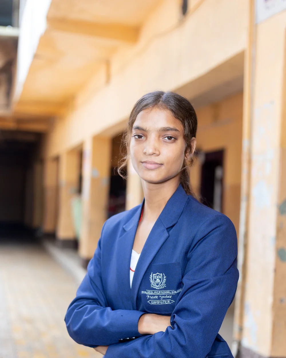 A member of the teaching staff photographed on the school verandah