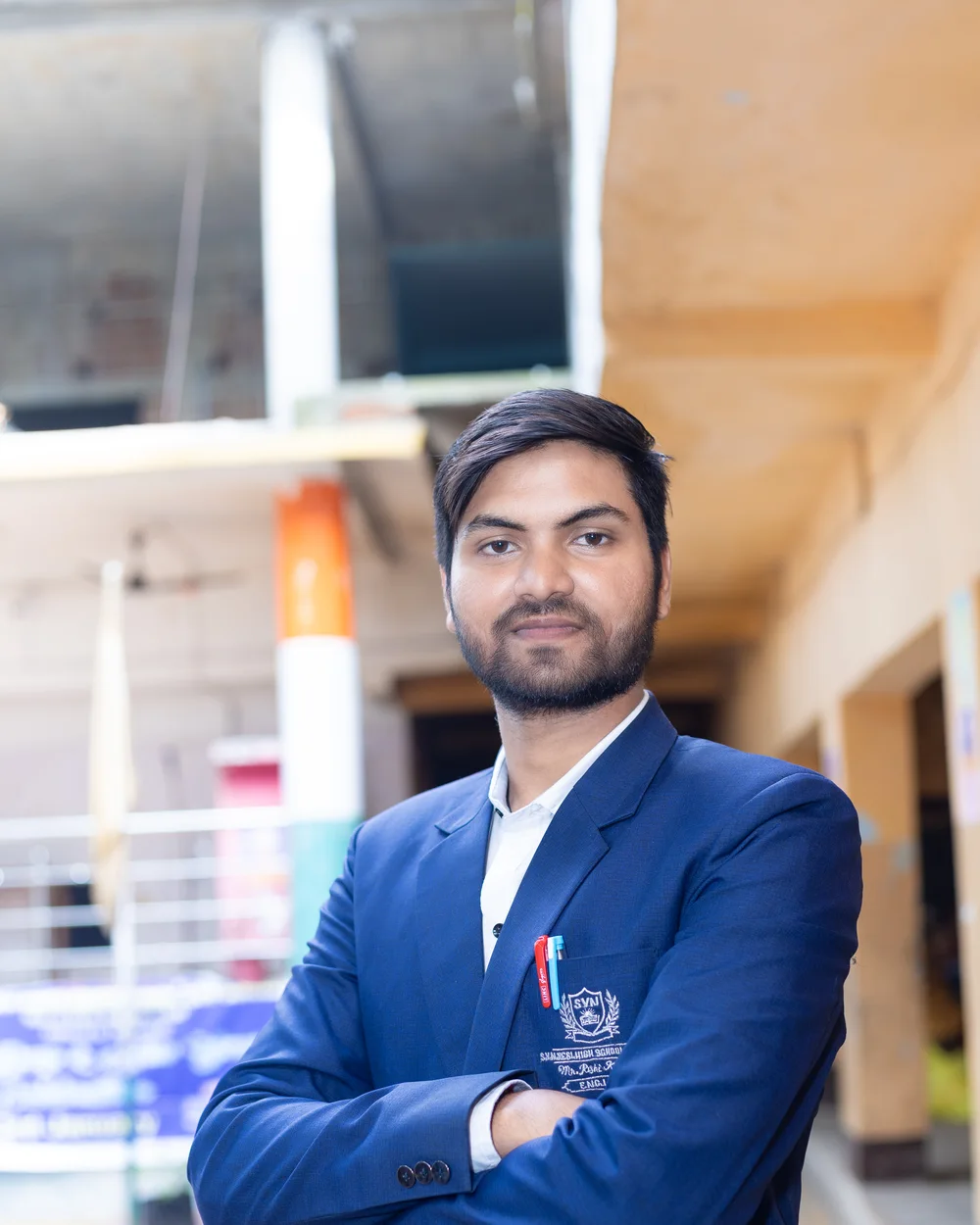 A member of the teaching staff photographed on the school verandah