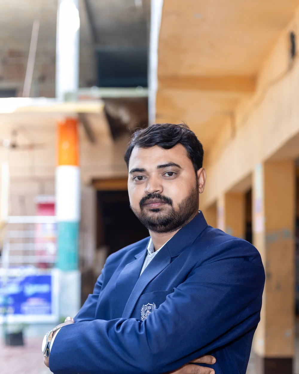 A member of the teaching staff photographed on the school verandah