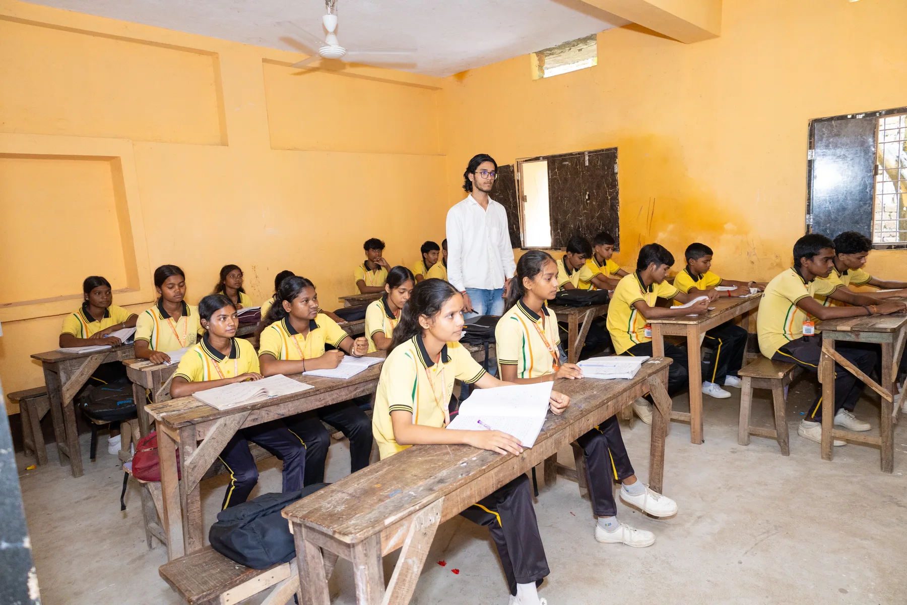 Primary wing children at work with their teacher