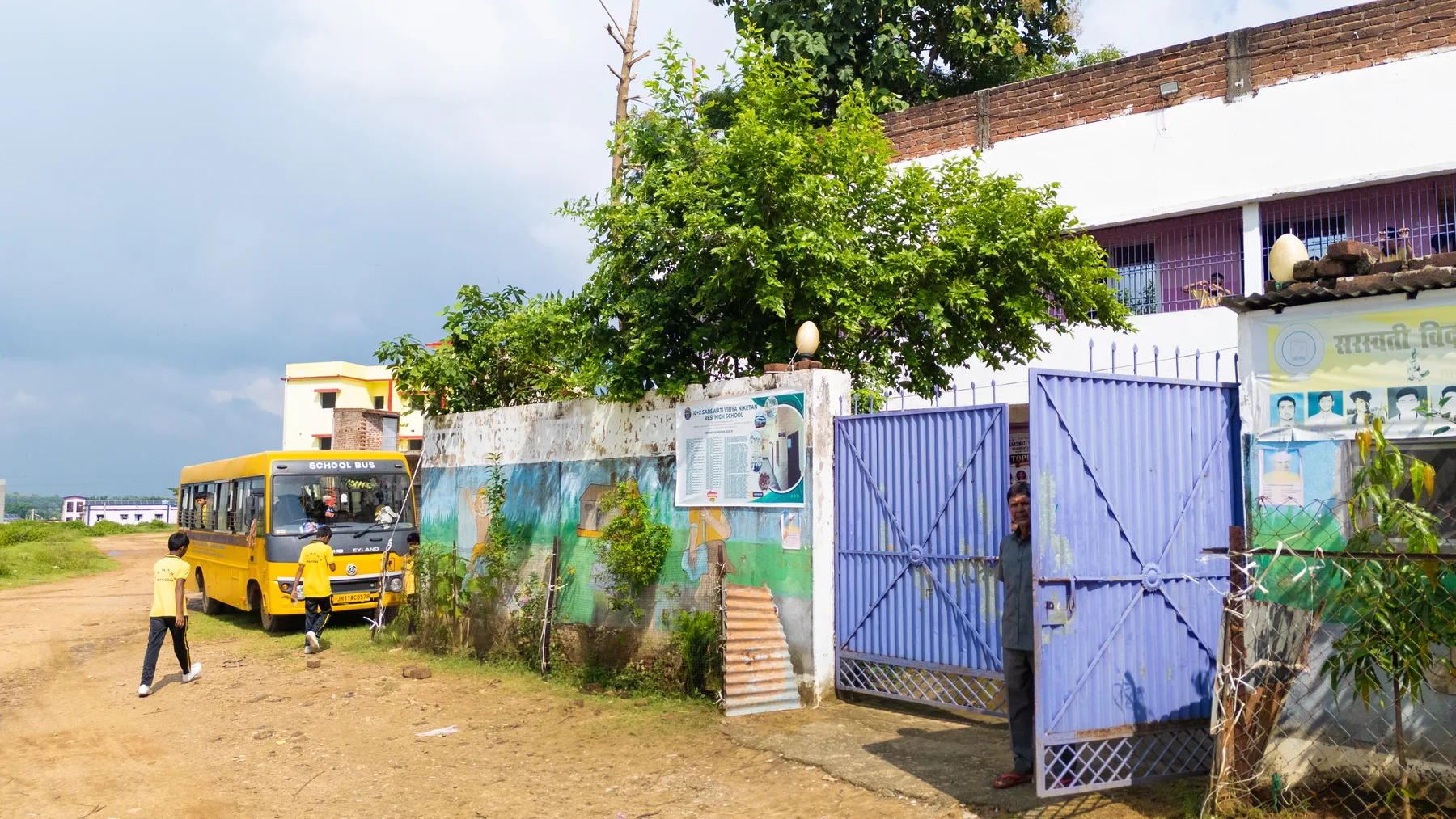 The school gate with the bus drawn up outside