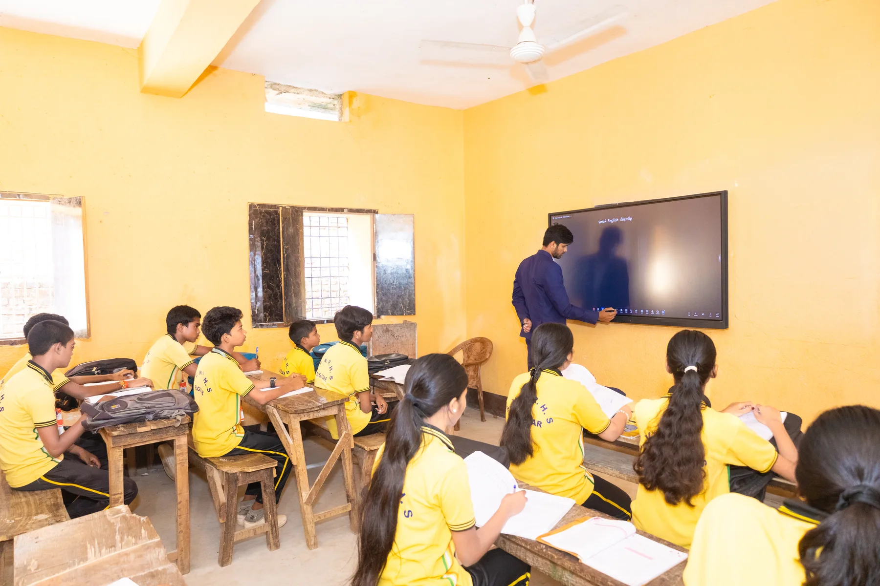 A class following a lesson on the digital board